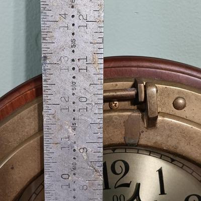 LOT 13: Bey Berk Brass Porthole Clock with Wooden Ship's Wheel Mirror & Lighthouse Wall Decor