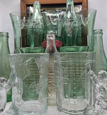 LOT 28: Have a Coke and a Smile/ Coca-Cola Glasses, Bottles, Metal Bottle Opener, and Framed Mirror
