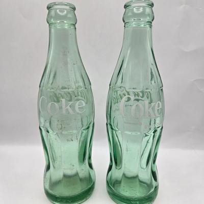 LOT 28: Have a Coke and a Smile/ Coca-Cola Glasses, Bottles, Metal Bottle Opener, and Framed Mirror