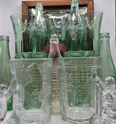LOT 28: Have a Coke and a Smile/ Coca-Cola Glasses, Bottles, Metal Bottle Opener, and Framed Mirror