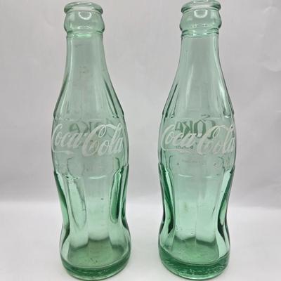LOT 28: Have a Coke and a Smile/ Coca-Cola Glasses, Bottles, Metal Bottle Opener, and Framed Mirror