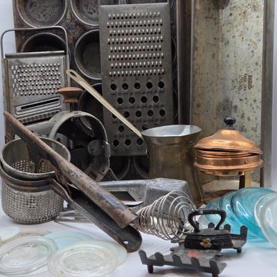 LOT 36: Vintage Kitchen Gadgets Including Hand Held Ice Crusher, Potato Masher, Cheese Graters, Can Opener, and More