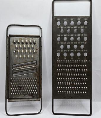 LOT 36: Vintage Kitchen Gadgets Including Hand Held Ice Crusher, Potato Masher, Cheese Graters, Can Opener, and More