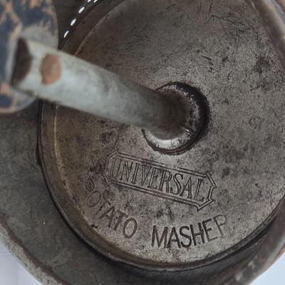 LOT 36: Vintage Kitchen Gadgets Including Hand Held Ice Crusher, Potato Masher, Cheese Graters, Can Opener, and More