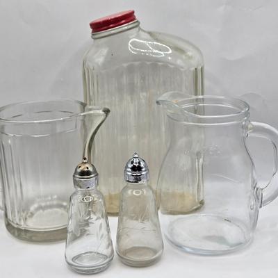LOT 37: Kitchen Cabinet Lot Including Salt and Pepper Shakers, Vintage Coffee Pot, Coasters, Mortar and Pestle, and More