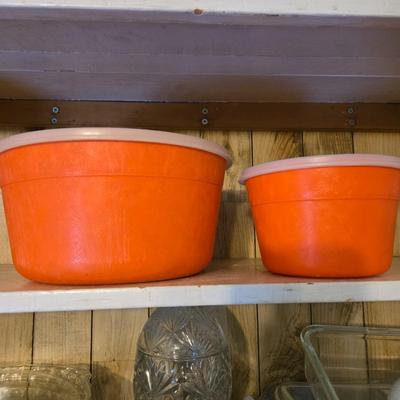 LOT 38: Kitchen Cabinet Lot: Tupperware Egg Tray, Avocado Green Napkin Holder & Salt/Pepper Shakers Strawberry Mugs, Glass Pie Pans,...