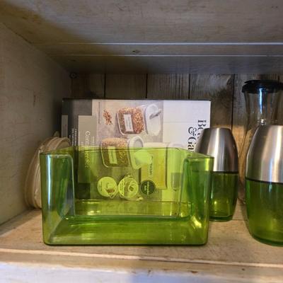 LOT 38: Kitchen Cabinet Lot: Tupperware Egg Tray, Avocado Green Napkin Holder & Salt/Pepper Shakers Strawberry Mugs, Glass Pie Pans,...