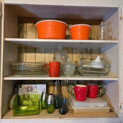 LOT 38: Kitchen Cabinet Lot: Tupperware Egg Tray, Avocado Green Napkin Holder & Salt/Pepper Shakers Strawberry Mugs, Glass Pie Pans,...