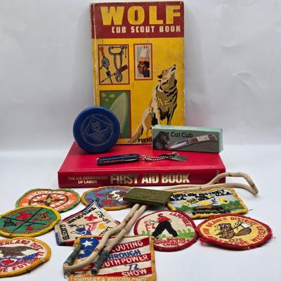 LOT 111: Cub Scout Book, First Aid Book, Boy Scout Patches, GI Joe Pocket Knife, Collapsible Cup, and More
