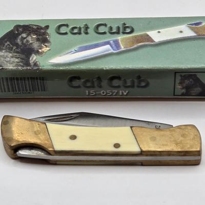 LOT 111: Cub Scout Book, First Aid Book, Boy Scout Patches, GI Joe Pocket Knife, Collapsible Cup, and More