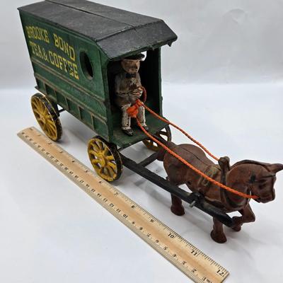 LOT 115: Vintage Cast Iron Brooke Bond Horse Drawn Wagon and Model T