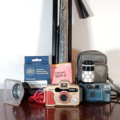LOT 149: Canon Sure Shot WP-1, Canon NB-6LH Compatible Batteries, Quantaray Tripod & More