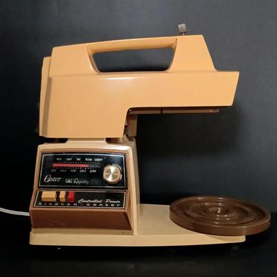 LOT 154: Oster Foodcrafter Regency Kitchen Center and Accessories along with a Hand Crank Food Processor