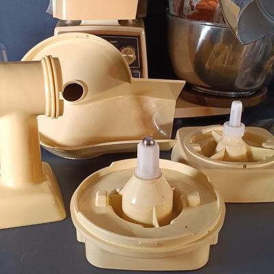 LOT 154: Oster Foodcrafter Regency Kitchen Center and Accessories along with a Hand Crank Food Processor