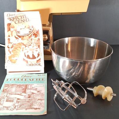 LOT 154: Oster Foodcrafter Regency Kitchen Center and Accessories along with a Hand Crank Food Processor