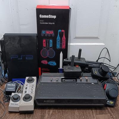 LOT 173: Vintage Console Lot- RadioShack TV ScoreBoard, Playstation 2 SCPH-50001, Atari 2600 with Accessories & More
