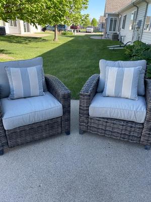 Two outdoor wicker-look chairs