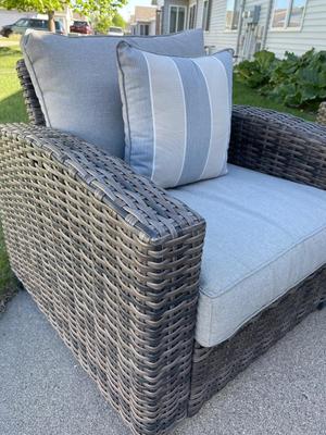 Two outdoor wicker-look chairs