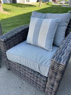 Two outdoor wicker-look chairs