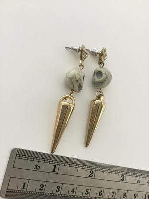 Gold tone skull fashion dangle earrings