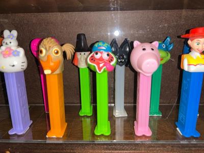 DISPLAY CASE LOADED WITH PEZ DISPENSERS