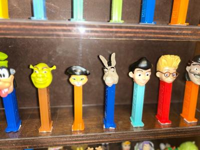 DISPLAY CASE LOADED WITH PEZ DISPENSERS