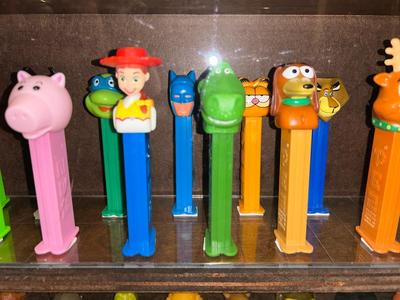 DISPLAY CASE LOADED WITH PEZ DISPENSERS