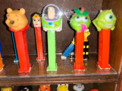 DISPLAY CASE LOADED WITH PEZ DISPENSERS