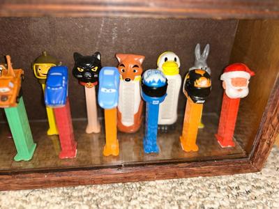 DISPLAY CASE LOADED WITH PEZ DISPENSERS