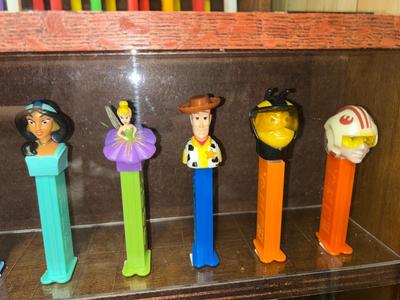 DISPLAY CASE LOADED WITH PEZ DISPENSERS