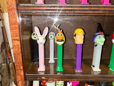 DISPLAY CASE LOADED WITH PEZ DISPENSERS