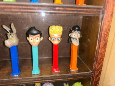 DISPLAY CASE LOADED WITH PEZ DISPENSERS