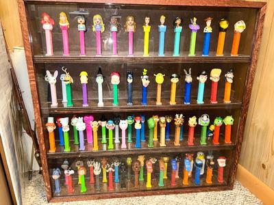 DISPLAY CASE LOADED WITH PEZ DISPENSERS