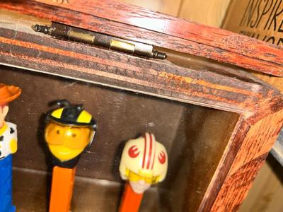 CLEVERLY MADE DISPLAY CASE FILLED WITH PEZ DISPENSERS
