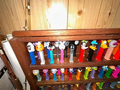 CLEVERLY MADE DISPLAY CASE FILLED WITH PEZ DISPENSERS
