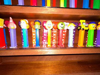 CLEVERLY MADE DISPLAY CASE FILLED WITH PEZ DISPENSERS