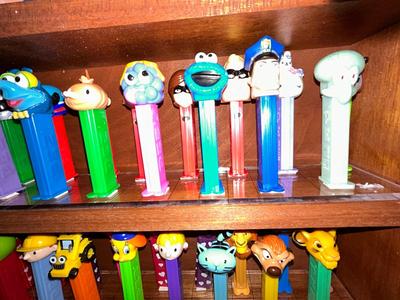 CLEVERLY MADE DISPLAY CASE FILLED WITH PEZ DISPENSERS