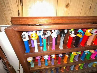 CLEVERLY MADE DISPLAY CASE FILLED WITH PEZ DISPENSERS