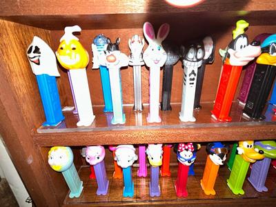 CLEVERLY MADE DISPLAY CASE FILLED WITH PEZ DISPENSERS