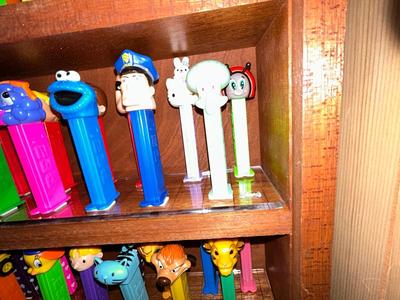 CLEVERLY MADE DISPLAY CASE FILLED WITH PEZ DISPENSERS