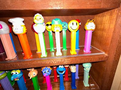 CLEVERLY MADE DISPLAY CASE FILLED WITH PEZ DISPENSERS