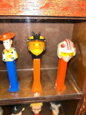 CLEVERLY MADE DISPLAY CASE FILLED WITH PEZ DISPENSERS