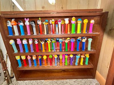 CLEVERLY MADE DISPLAY CASE FILLED WITH PEZ DISPENSERS
