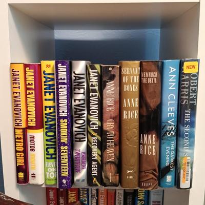 LOT 140: Large Lot of Books with Bookshelf Featuring Anne Rice, Janet Evanovich, Ann Cleeves & More