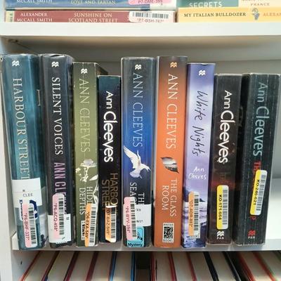 LOT 140: Large Lot of Books with Bookshelf Featuring Anne Rice, Janet Evanovich, Ann Cleeves & More