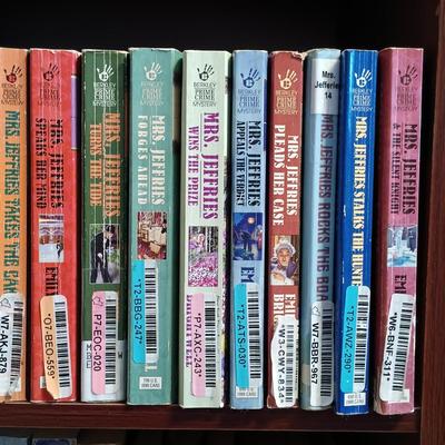 LOT 141: Large Collection of Mystery Novels with Bookshelf Featuring Ngaio Marsi, Martha Grimes, Emily Brightwell & More