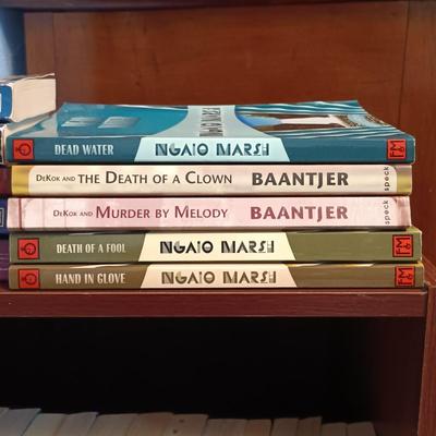 LOT 141: Large Collection of Mystery Novels with Bookshelf Featuring Ngaio Marsi, Martha Grimes, Emily Brightwell & More