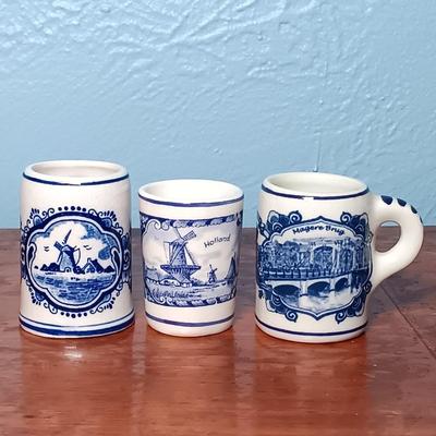 LOT 151: Delft Blue Distel House Ashtray, Delft Toothpicker Holder, Delft Bottle Made for Bols Royal Distilleries & More