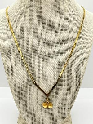 LOT 240J: 14K Yellow Gold Sun Oil Logo Charm Necklace with Diamond Chip