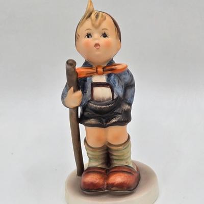 LOT 31D: Goebel Hummel Figurines Including Night Watchman, Little Pastry Cook, Little Hiker, Surprise AKA Hansel & Gretel, and Little...